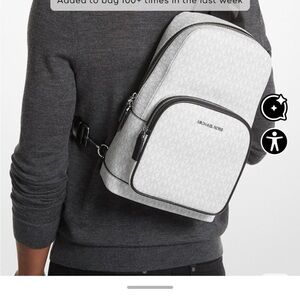 Michael Kors White Monogram Sling Backpack with Black Trim